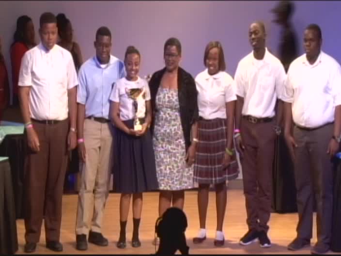 Team Nevis with their winning trophy for the 45th annual Leeward Island Debating Competition at the closing ceremony at the Nevis Performing Arts Centre on February 27, 2017